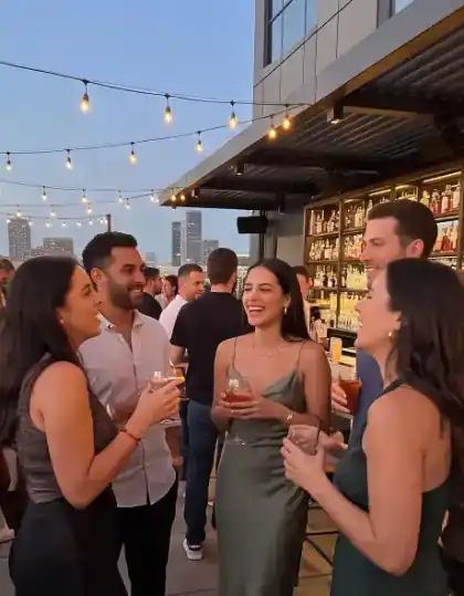 In a group of five at the rooftop bar